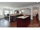 Open concept kitchen with island and hardwood flooring at 3913 Widgeon Way, Waxhaw, NC 28173