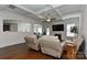 Bright and airy living room featuring coffered ceilings and gleaming hardwood floors at 3913 Widgeon Way, Waxhaw, NC 28173