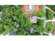 Aerial view of the home with bordered lot, mature trees, patio, deck and other homes visible at 4007 Lake Shore S Rd, Denver, NC 28037