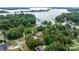 Aerial view showcasing the property's waterfront location and lush surroundings on Lake Norman at 4007 Lake Shore S Rd, Denver, NC 28037