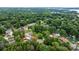 Aerial view of a neighborhood nestled among lush trees and landscaping at 4007 Lake Shore S Rd, Denver, NC 28037