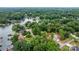 Aerial view showcasing the home's location, surrounding lake, lush greenery, and neighborhood layout at 4007 Lake Shore S Rd, Denver, NC 28037