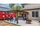 Backyard patio featuring a pergola, hot tub, seating area, and decorative elements, ideal for relaxation and gatherings at 4007 Lake Shore S Rd, Denver, NC 28037
