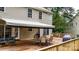 Inviting backyard with a wooden deck and a picturesque view of the trees at 4007 Lake Shore S Rd, Denver, NC 28037