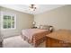 Cozy bedroom featuring a large window and wood furnishings at 4007 Lake Shore S Rd, Denver, NC 28037