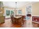Inviting dining room with hardwood floors, traditional decor, and large windows to the backyard at 4007 Lake Shore S Rd, Denver, NC 28037