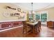 Charming dining room with hardwood floors, tray ceilings, elegant lighting, and large windows for ample natural light at 4007 Lake Shore S Rd, Denver, NC 28037