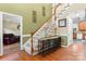 Inviting foyer with hardwood floors, staircase, and decorative accents at 4007 Lake Shore S Rd, Denver, NC 28037