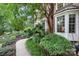 Charming home exterior with lush landscaping and a brick facade at 4007 Lake Shore S Rd, Denver, NC 28037