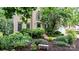 Brick home with mature landscaping and flowering trees and bushes at 4007 Lake Shore S Rd, Denver, NC 28037