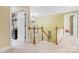 Bright hallway with a chandelier and views into other rooms; carpeted floor at 4007 Lake Shore S Rd, Denver, NC 28037