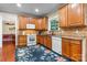 Well-lit kitchen with wooden cabinets, tile backsplash, and stainless steel appliances at 4007 Lake Shore S Rd, Denver, NC 28037