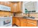 Updated kitchen features wood cabinets, granite countertops, and a stainless steel sink at 4007 Lake Shore S Rd, Denver, NC 28037