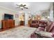 Cozy living room features a large brown leather sectional and hardwood floors at 4007 Lake Shore S Rd, Denver, NC 28037