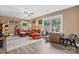 Comfortable living room with stylish decor, hardwood flooring, and natural light from multiple windows at 4007 Lake Shore S Rd, Denver, NC 28037
