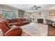 Spacious living room featuring hardwood floors, fireplace, and ample natural light at 4007 Lake Shore S Rd, Denver, NC 28037