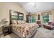 Main bedroom with a large decorative headboard and two side chairs at 4007 Lake Shore S Rd, Denver, NC 28037