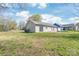 Large backyard featuring sliding glass doors, a well-manicured lawn, and plenty of natural light at 425 Austin Dr, Charlotte, NC 28213