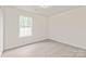 Bright bedroom features a window for natural light and hardwood floors at 425 Austin Dr, Charlotte, NC 28213