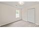 Relaxing bedroom with a window and closet providing natural light at 425 Austin Dr, Charlotte, NC 28213