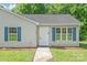 Close up showcasing the front door and exterior of a cozy, charming home at 425 Austin Dr, Charlotte, NC 28213