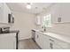 Updated kitchen with white cabinets, quartz countertops, and stainless steel appliances at 425 Austin Dr, Charlotte, NC 28213