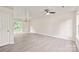 Bright, airy living room with wood-look flooring, a chandelier, and sliding glass doors at 425 Austin Dr, Charlotte, NC 28213