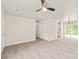 Spacious living room with neutral walls, wood-look floors, multiple doors, and recessed lighting at 425 Austin Dr, Charlotte, NC 28213