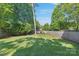 Spacious backyard with play structure invites outdoor fun amidst lush greenery and a serene atmosphere at 4526 Longwood Dr, Charlotte, NC 28209