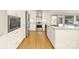 Bright kitchen with stainless steel appliances, white cabinetry, and granite countertops at 4526 Longwood Dr, Charlotte, NC 28209
