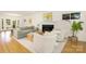 Bright living room featuring a cozy seating area with a fireplace and natural light at 4526 Longwood Dr, Charlotte, NC 28209