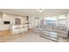 Open-concept living space with a kitchen, living room, and bar seating, perfect for entertaining at 4526 Longwood Dr, Charlotte, NC 28209