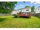 Great backyard features a green lawn and a wooden deck perfect for outdoor enjoyment at 4982 Bentgrass Run Dr, Charlotte, NC 28269