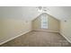 Spacious bedroom features neutral paint, carpet, vaulted ceiling, and a window at 4982 Bentgrass Run Dr, Charlotte, NC 28269