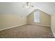Bedroom with vaulted ceiling, neutral paint and carpet, and a ceiling fan at 4982 Bentgrass Run Dr, Charlotte, NC 28269