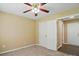 Neutral bedroom with closet featuring a ceiling fan with light and neutral carpet at 4982 Bentgrass Run Dr, Charlotte, NC 28269