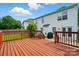 Large wooden deck with an outdoor grill, perfect for entertaining at 4982 Bentgrass Run Dr, Charlotte, NC 28269
