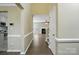 Open layout view of the kitchen, living room, and staircase at 4982 Bentgrass Run Dr, Charlotte, NC 28269