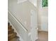 Bright entryway features wood floors, a staircase, and an open floor plan at 4982 Bentgrass Run Dr, Charlotte, NC 28269