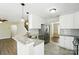 Stylish kitchen featuring stainless steel appliances, granite countertops, and modern fixtures at 4982 Bentgrass Run Dr, Charlotte, NC 28269