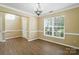 Spacious living room with lots of light, wood floors, and neutral paint at 4982 Bentgrass Run Dr, Charlotte, NC 28269