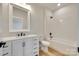 Modern bathroom with white vanity, sleek fixtures, and a shower-tub combination at 513 Sacco St, Belmont, NC 28012