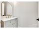 Bathroom with a stylish mirror and vanity, and gold accents at 513 Sacco St, Belmont, NC 28012