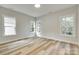Bedroom with many windows and luxury vinyl plank flooring at 513 Sacco St, Belmont, NC 28012