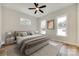 Comfortable bedroom with neutral decor, hardwood floors, and natural light at 513 Sacco St, Belmont, NC 28012