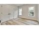 Bedroom featuring natural light from two windows and a closet with double doors at 513 Sacco St, Belmont, NC 28012