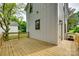 Side view of the wooden deck highlighting the outdoor living space and house siding at 513 Sacco St, Belmont, NC 28012