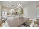Dining area featuring a table set with seating, and a pendant light fixture above at 513 Sacco St, Belmont, NC 28012