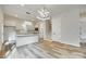 Dining area with a view of the kitchen and stairs. Modern pendant lighting at 513 Sacco St, Belmont, NC 28012