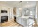 Bright kitchen island with modern fixtures, and view of open floor plan at 513 Sacco St, Belmont, NC 28012